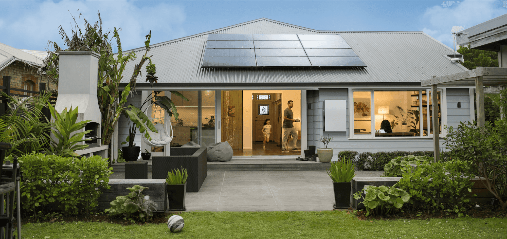 Front-yard looking into home with father and daughter playing.